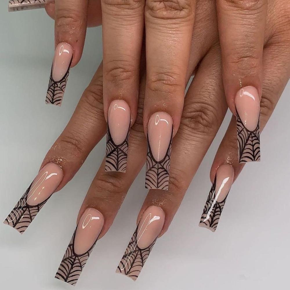 Black and nude spiderweb acrylic nails for halloween 