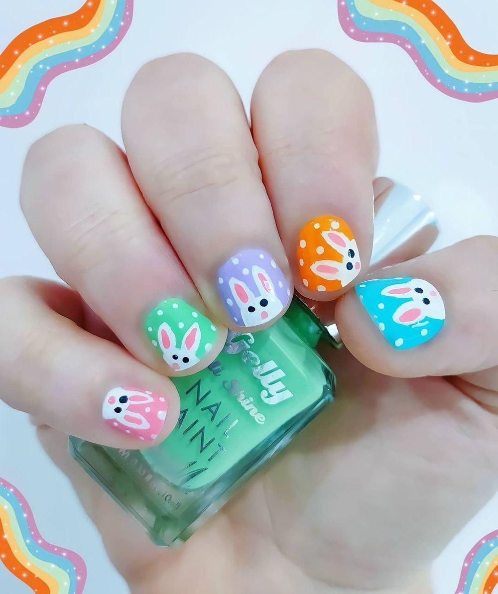 Bright nails with bunnies and specks