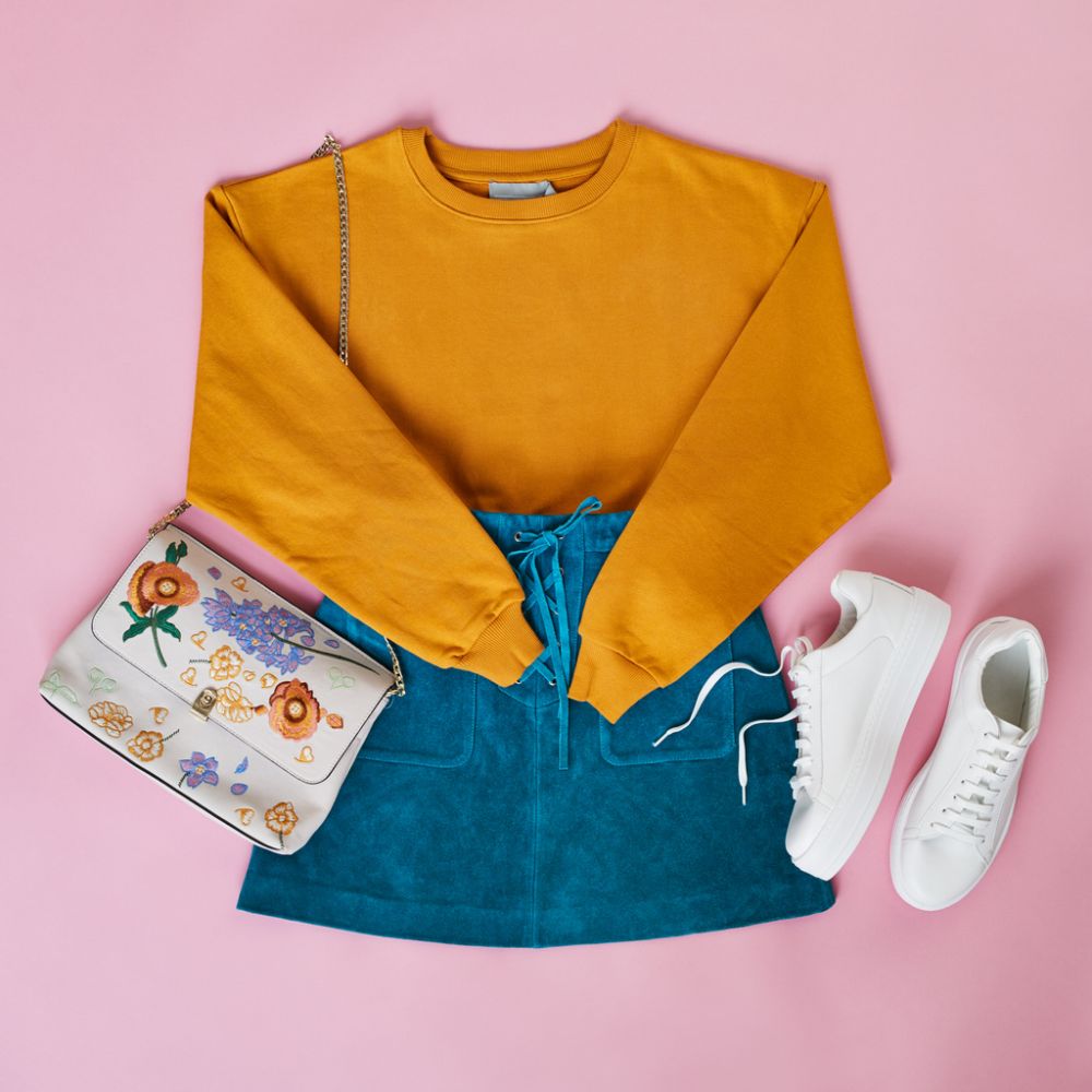 Brightly colored blouses with denim skirts and sneakers