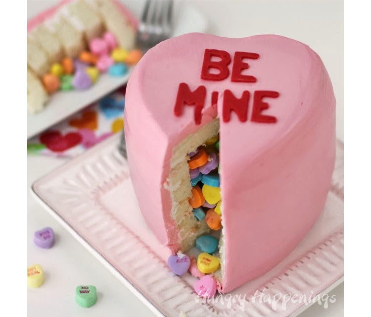 Conversation heart piñata cake