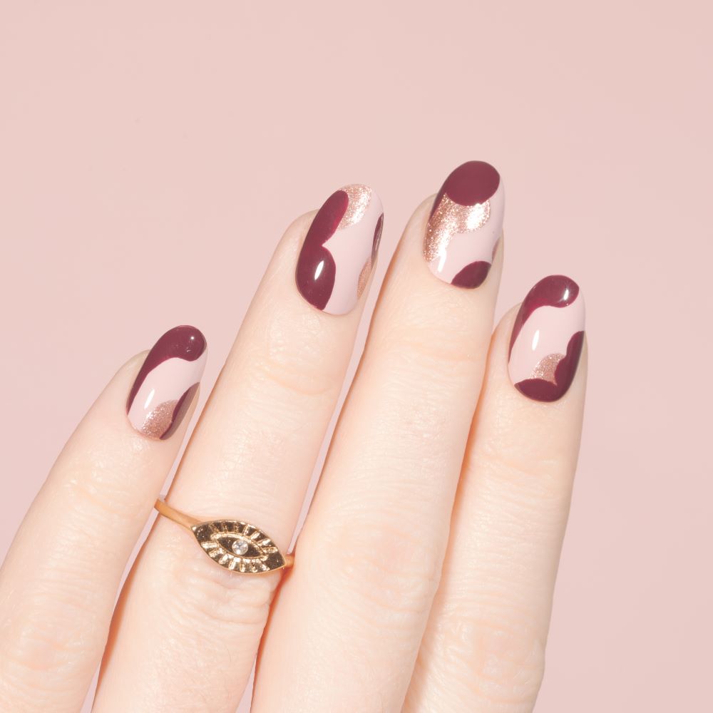 Cranberry and rose gold manicure