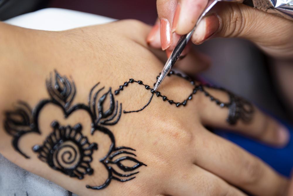 Flower henna hand tattoo
