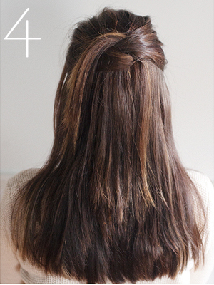 Knot and toss half up hairdo